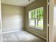 Bright bedroom with a large window, neutral walls, and plush carpeting at 11154 Schoolhouse Rd, Fishers, IN 46037
