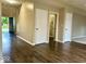 Inviting entryway features wood-like flooring, neutral paint, and direct access to various rooms at 11154 Schoolhouse Rd, Fishers, IN 46037