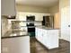 Updated kitchen featuring an island, stainless steel appliances, and granite countertops at 11154 Schoolhouse Rd, Fishers, IN 46037
