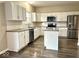 Modern kitchen featuring stainless steel appliances, an island, and ample counter space at 11154 Schoolhouse Rd, Fishers, IN 46037