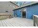 Backyard featuring freshly painted deck and house with access door on a sunny day at 1151 S Randolph St, Indianapolis, IN 46203