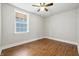 Bedroom featuring hardwood floors and a large window at 1151 S Randolph St, Indianapolis, IN 46203