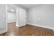 A bedroom with hardwood floors and a large closet at 1151 S Randolph St, Indianapolis, IN 46203