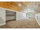 Bonus room with wood ceiling, large closet, carpeted floors, and lots of space to entertain at 1151 S Randolph St, Indianapolis, IN 46203