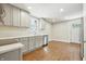 Bright kitchen featuring gray cabinets, white countertops, and stainless steel appliances at 1151 S Randolph St, Indianapolis, IN 46203