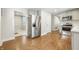 Kitchen with stainless steel appliances, gray cabinets, and hardwood floors at 1151 S Randolph St, Indianapolis, IN 46203