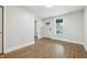 Living room showcasing hardwood floors, white walls, and natural light at 1151 S Randolph St, Indianapolis, IN 46203