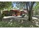 Outdoor space with a patio area, wooden pergola and lush greenery at 1346 N Buck Creek Rd, Greenfield, IN 46140