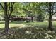 Expansive backyard featuring mature trees and lush green lawn at 1346 N Buck Creek Rd, Greenfield, IN 46140