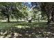 Large backyard with mature trees and space for outdoor activities at 1346 N Buck Creek Rd, Greenfield, IN 46140