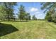Large, grassy backyard featuring well-maintained lawn at 1346 N Buck Creek Rd, Greenfield, IN 46140