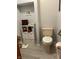 Cozy bathroom features stylish storage shelves and a neutral color scheme creating a relaxing space at 1346 N Buck Creek Rd, Greenfield, IN 46140