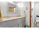 Bright bathroom featuring a double vanity with granite countertop and traditional cabinets at 1346 N Buck Creek Rd, Greenfield, IN 46140