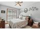 Cozy bedroom with a queen bed, decorative accents, and abundant natural light at 1346 N Buck Creek Rd, Greenfield, IN 46140