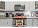 Modern kitchen with stainless steel appliances, white cabinets, and granite countertops at 1346 N Buck Creek Rd, Greenfield, IN 46140