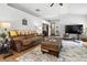 Spacious living room featuring comfortable seating, a patterned rug, and ample natural light at 1346 N Buck Creek Rd, Greenfield, IN 46140