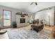 Inviting living room with stone fireplace, wood floors, and plenty of natural light at 1346 N Buck Creek Rd, Greenfield, IN 46140