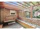 Covered wooden pergola with swing bench and plenty of seating, great for outdoor relaxation at 1346 N Buck Creek Rd, Greenfield, IN 46140