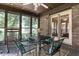 Inviting sunroom featuring a ceiling fan and screened windows at 1346 N Buck Creek Rd, Greenfield, IN 46140