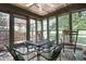 Inviting sunroom featuring a ceiling fan and screened windows at 1346 N Buck Creek Rd, Greenfield, IN 46140