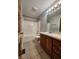 Bathroom with vanity, mirror, toilet and bath/shower combo at 1633 Belfield St, Indianapolis, IN 46217