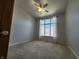 Inviting bedroom featuring neutral walls, carpet and a bright window with white trim offering natural light at 1633 Belfield St, Indianapolis, IN 46217