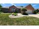 Attractive brick home with meticulous landscaping, including stone mulch and flowering shrubs at 1633 Belfield St, Indianapolis, IN 46217