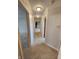 Hallway with carpeted flooring leading to various rooms in the house at 1633 Belfield St, Indianapolis, IN 46217