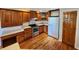Well-equipped kitchen with cherry cabinets, stainless steel appliances, and desk space at 1633 Belfield St, Indianapolis, IN 46217