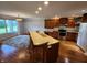 Modern kitchen with cherry wood cabinets, stainless steel appliances, and an island at 1633 Belfield St, Indianapolis, IN 46217