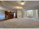 Open-concept design with a cozy living area flowing into a kitchen with bar seating at 1633 Belfield St, Indianapolis, IN 46217