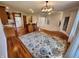 Open-concept floor plan featuring beautiful hardwood floors, a decorative rug, and plenty of natural light at 1633 Belfield St, Indianapolis, IN 46217