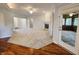 Spacious living room features a fireplace, ceiling fan, and access to a sunroom at 1633 Belfield St, Indianapolis, IN 46217
