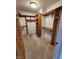 Well-organized walk-in closet provides ample storage with shelving and rod space at 1633 Belfield St, Indianapolis, IN 46217