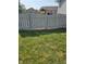 A spacious backyard featuring a well-maintained lawn and a privacy fence at 1706 Creekwater Pass, Greenfield, IN 46140