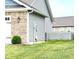Charming home exterior with brick accents and a well-maintained lawn at 1706 Creekwater Pass, Greenfield, IN 46140