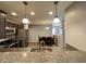 Modern kitchen featuring granite counters and stainless steel appliances with a dining area beyond at 1706 Creekwater Pass, Greenfield, IN 46140