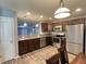 Modern kitchen with stainless steel appliances, granite counters, and wood floors, perfect for cooking at 1706 Creekwater Pass, Greenfield, IN 46140