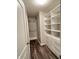 Walk-in closet offers generous shelving and storage space for clothes and accessories at 1706 Creekwater Pass, Greenfield, IN 46140