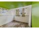 Finished room with laminate flooring, quirky ceiling, and bright decor accents at 1809 Mutz Dr, Indianapolis, IN 46229