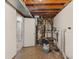 Utility room featuring a water heater and other plumbing and HVAC components at 1809 Mutz Dr, Indianapolis, IN 46229