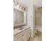 Bathroom with white vanity, tile floors and shower-tub combination at 1809 Mutz Dr, Indianapolis, IN 46229