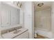 Bathroom with white vanity and a shower-tub combination at 1809 Mutz Dr, Indianapolis, IN 46229