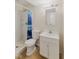 Functional bathroom featuring a stand up shower and single sink vanity at 1809 Mutz Dr, Indianapolis, IN 46229