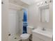 Functional bathroom featuring a stand up shower and single sink vanity at 1809 Mutz Dr, Indianapolis, IN 46229