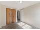 Carpeted bedroom with bright natural light and closet at 1809 Mutz Dr, Indianapolis, IN 46229
