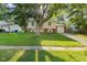 Charming home featuring a well-manicured lawn and mature shade tree at 1809 Mutz Dr, Indianapolis, IN 46229