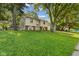 Charming split-level home with well-maintained lawn and mature trees at 1809 Mutz Dr, Indianapolis, IN 46229