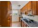 Kitchen featuring wooden cabinets and stainless steel sink at 1809 Mutz Dr, Indianapolis, IN 46229