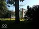 Spacious backyard view showcasing the home's rear exterior and natural surroundings at 18378 Southeastern Pkwy, Fortville, IN 46040